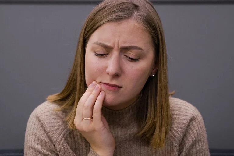 Woman experiencing bruxism