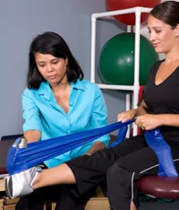 Physiotherapist guiding an athlete for calf strains.