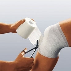A person treating joint injury.