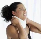 Woman experiencing whiplash injury.