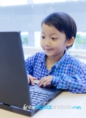 A youth focused on a computer and representation of someone that might have Youth Injuries
