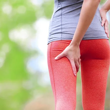 Woman managing hamstring tear recovery