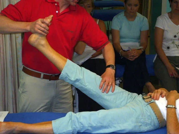 A man giving a massage to a lady experiencing nerve pain