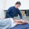 Osteopath working on patient