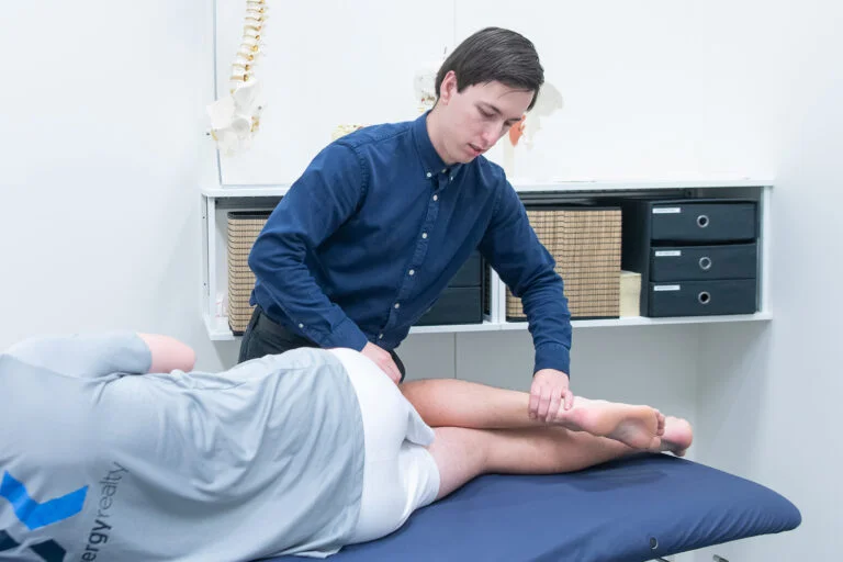 Osteopath working on patient