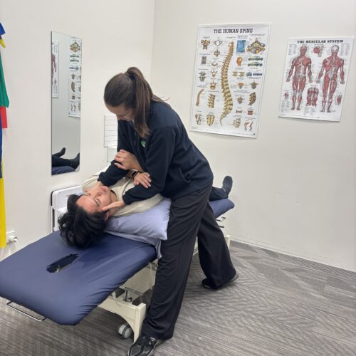 Patient lying down being tested for BPPV